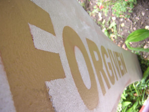 Closeup picture of sign that says "Forgiven"