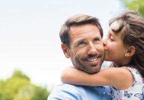 Picture of girl kissing father, enjoying the moment